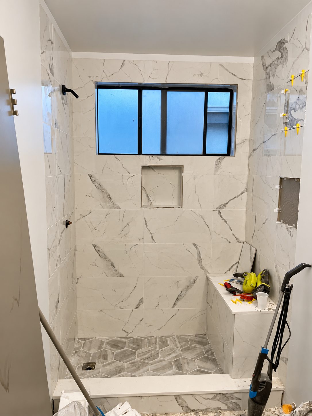 Finished tile with niche and bench, before glass